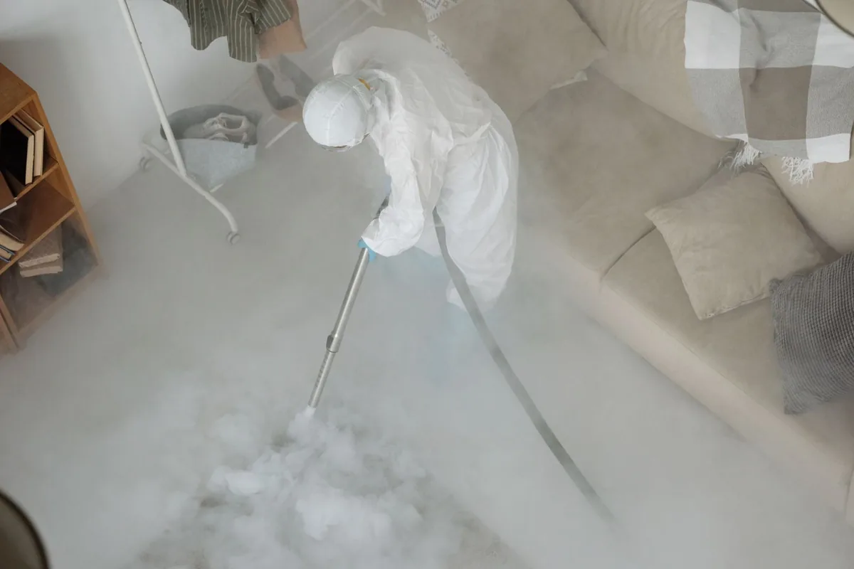 Biohazard cleanup technician in protective equipment, Central, TN